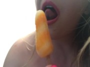 Blonde teasing with boobs and popsicle 9/16