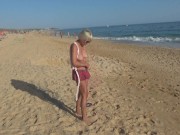 Naked blonde on a Nude beach. Masturbating and pissing. 6/16