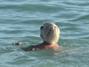 Naked blonde on a Nude beach. Masturbating and pissing. 8/16