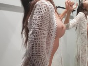 Girl changes clothes in a fitting room 12/16