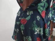 Girl changes clothes in a fitting room 16/16