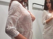 Girl changes clothes in a fitting room 5/16