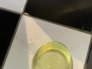 Dirty slut in plaid skirt and stripper heels fills a  glass with piss 13/16