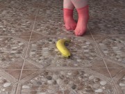 Fat legs in socks ruthlessly trample banana. Crush Fetish, foot fetish. 1/16