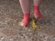 Fat legs in socks ruthlessly trample banana. Crush Fetish, foot fetish. 13/16