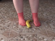 Fat legs in socks ruthlessly trample banana. Crush Fetish, foot fetish. 3/16