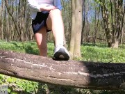 Beautiful woman walking nude with a clit pump outdoors in a public forest 3/16