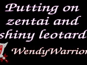 Putting on a leotard over a padlocked zentai 1/16