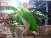 Rural striptease. Country girl dancing in the yard of her house Rustic striptease with banana leaf 7/16