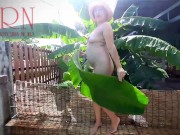 Rural striptease. Country girl dancing in the yard of her house Rustic striptease with banana leaf 8/16