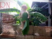 Rural striptease. Country girl dancing in the yard of her house  Rustic striptease with banana leaf 11/16