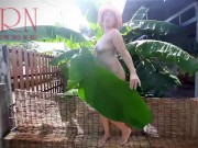 Rural striptease. Country girl dancing in the yard of her house  Rustic striptease with banana leaf 8/16