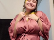 Goth girl gives playful strip tease dance in silk robe 