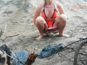 Public peeing teen girl on the beach 11/16