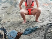 Public peeing teen girl on the beach 12/16