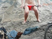 Public peeing teen girl on the beach 2/16