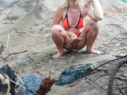 Public peeing teen girl on the beach 9/16