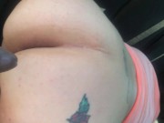 Soccer mom outside while her son has practice