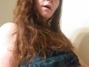 Sexy red head smoking and playing with titties