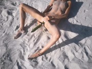 Amateur nudist teen fucks her tight pussy with a huge cucumber on a public beach. Ends with a pee.  10/16