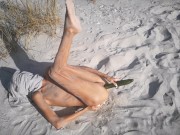 Amateur nudist teen fucks her tight pussy with a huge cucumber on a public beach. Ends with a pee.  11/16