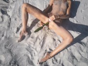 Amateur nudist teen fucks her tight pussy with a huge cucumber on a public beach. Ends with a pee.  13/16