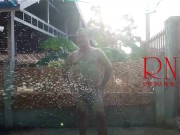 A housekeeper in a collar is tied with a rope to the fence of the yard. 11/16