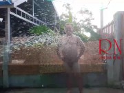 A housekeeper in a collar is tied with a rope to the fence of the yard. 5/16