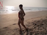 Nice lady at lonely nudist beach. Red swimsuit. Red bikini. 13/16