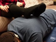 A slave in a collar is kneeling legs in black socks and tights 7/16