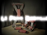 Submissive Redhead MILF tied to Cross and tortured with clothespins 1/16