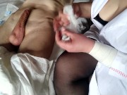 Nurse makes a new procedure for a patient in a diaper 15/16