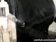 Blonde girl in black rubber catsuit in bathroom relaxes in wet latex and peeing in the bathtub 8/16