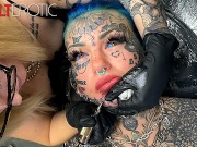 Gorgeous chick covered in tattoos gets another tattoo on her face