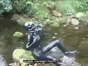 Outdoor walk in the wood and river bath full encased in black latex catsuit and rubber gas mask 13/16