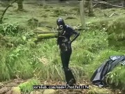 Outdoor walk in the wood and river bath full encased in black latex catsuit and rubber gas mask 4/16