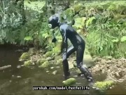 Outdoor walk in the wood and river bath full encased in black latex catsuit and rubber gas mask 5/16