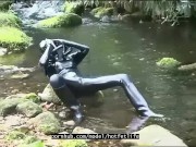 Outdoor walk in the wood and river bath full encased in black latex catsuit and rubber gas mask 9/16
