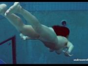 Russian teen babe Piyavka shows her developed big tits body in the pool 12/16