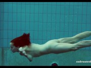 Russian teen babe Piyavka shows her developed big tits body in the pool 15/16