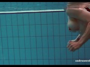 Russian teen babe Piyavka shows her developed big tits body in the pool 16/16