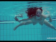 Russian teen babe Piyavka shows her developed big tits body in the pool 7/16