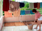Naked laundry. The maid is drying clothes in the laundry. 9/16