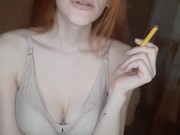 redhead girl smokes a cigarette 2/16
