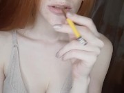 redhead girl smokes a cigarette 6/16