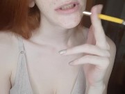 redhead girl smokes a cigarette 7/16