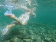 Slim girl swims naked in sea and masturbate her pussy 1/16