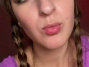 Giantess looks to tiny man before eating