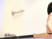 Showering teen enjoys solo masturbation 10/16