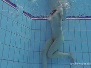 Floating babe in the warm pool getting naked 12/16